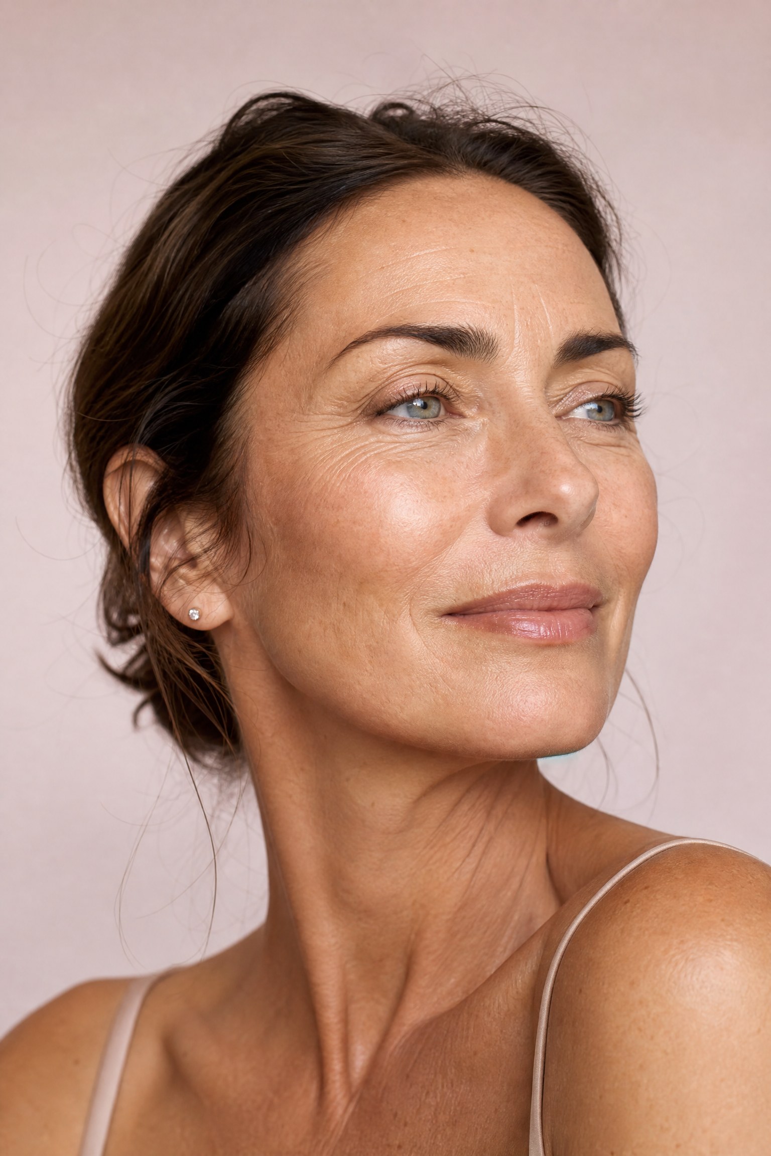 Close-up portrait of a woman’s face showing fine lines around the eyes and forehead — the key areas treated for fine lines and wrinkles at Facial Sculpting London