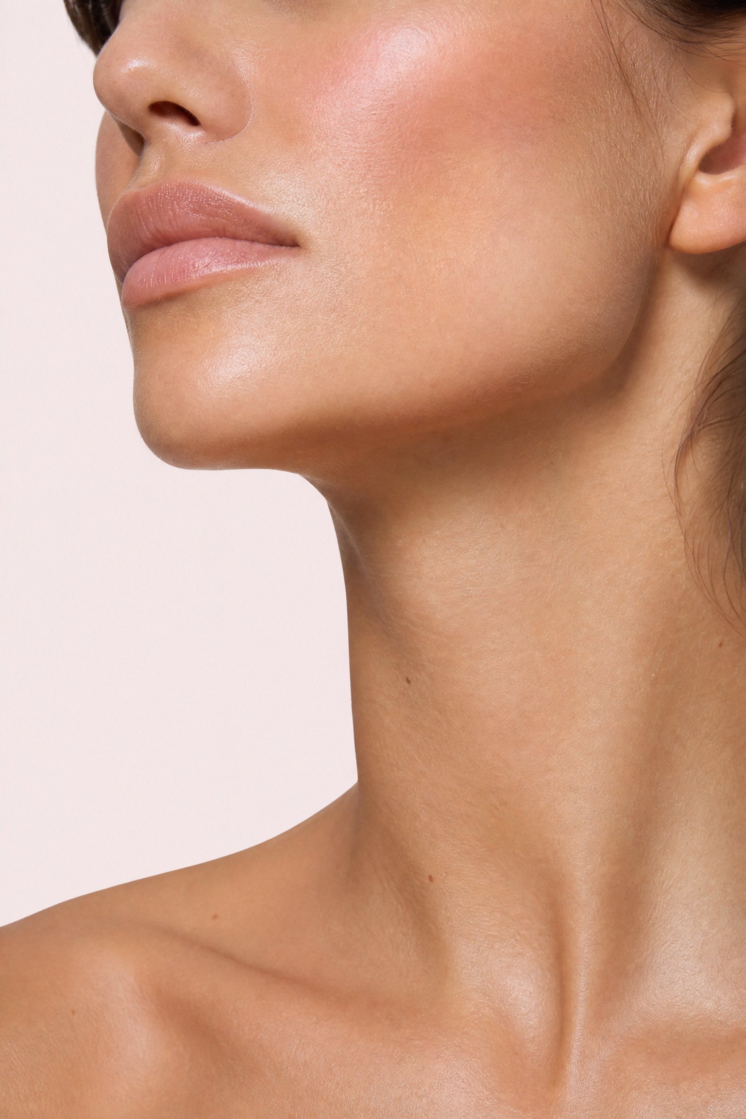 Close-up of a defined lower face and jawline — the masseter area treated for a square jaw and teeth grinding (bruxism) at Facial Sculpting London